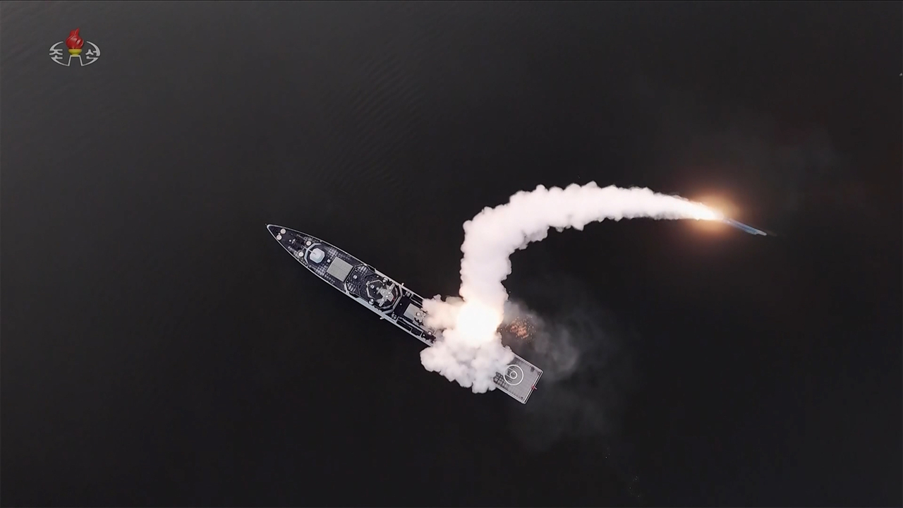 The Choe Hyon destroyer test-fires strategic cruise missiles in the Yellow Sea on March 10, 2026, with the sun setting in the background, in this photo taken from the North's official Korean Central Television the next day.   (Yonhap)