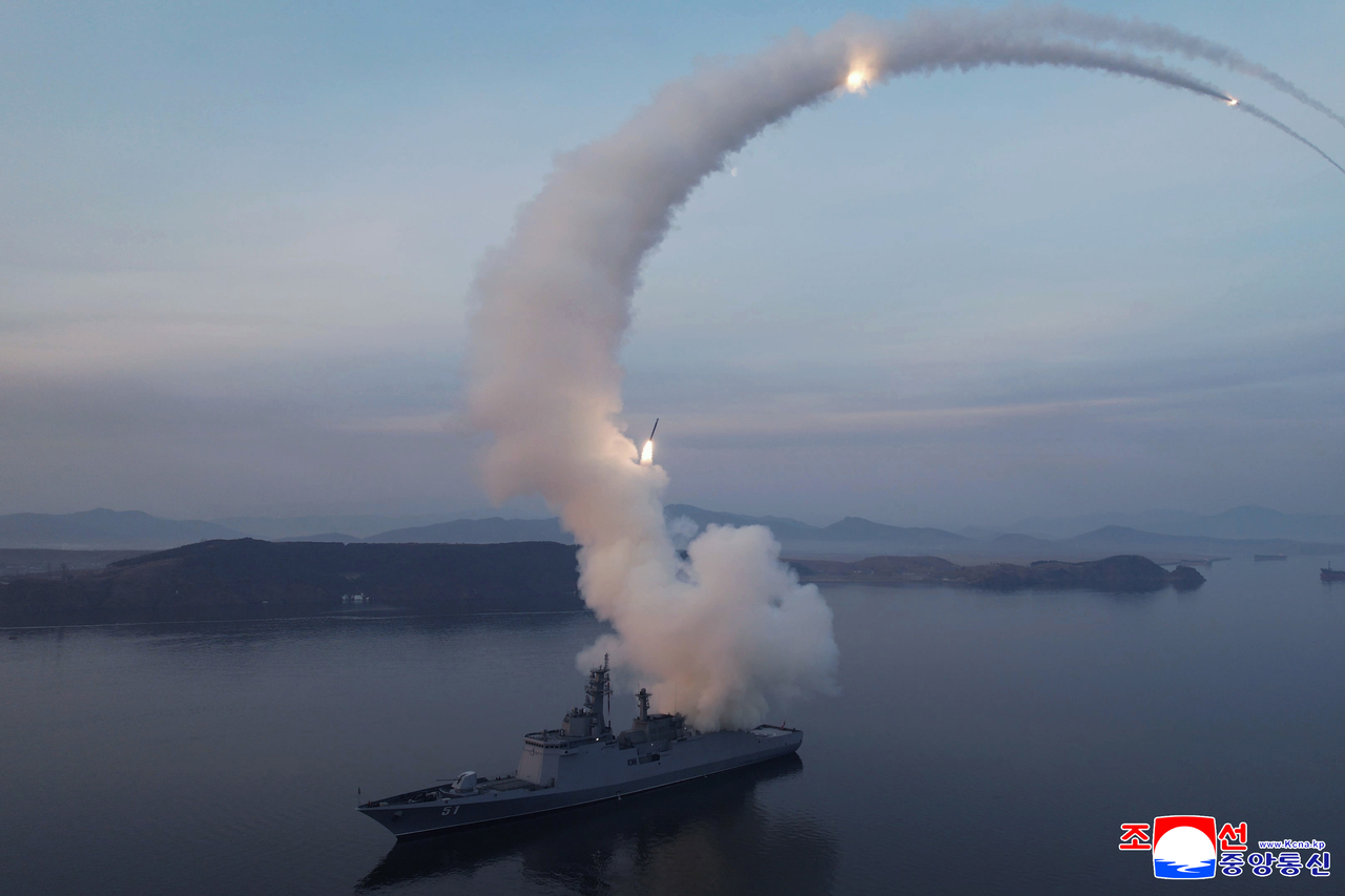 Photograph released by North Korean media shows projectiles launching from the Choe Hyon destroyer. (Yonhap)