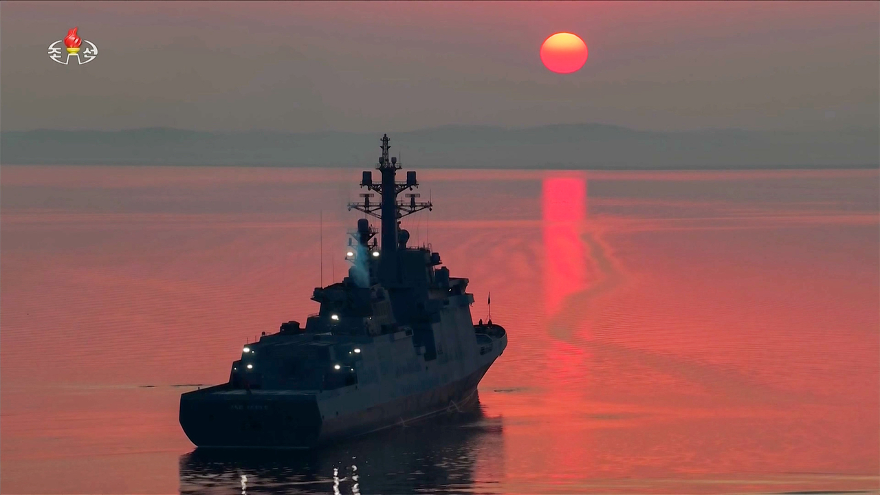 The Choe Hyon destroyer prepares to test-fire strategic cruise missiles in the Yellow Sea on March 10, 2026, with the sun setting in the background, in this photo taken from the North's official Korean Central Television the next day. (Yonhap)