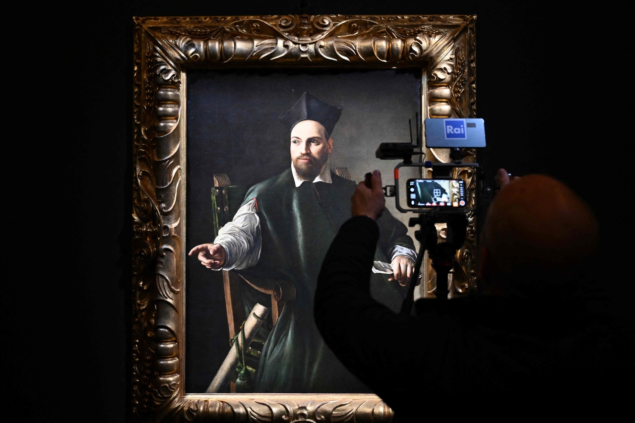 A cameraman films Caravaggio's "Portrait de Maffeo Barberini," at the Gallerie Nazionali di Arte Antica of Barberini palace, in Rome, Nov. 22, 2024.   (AFP-Yonhap)