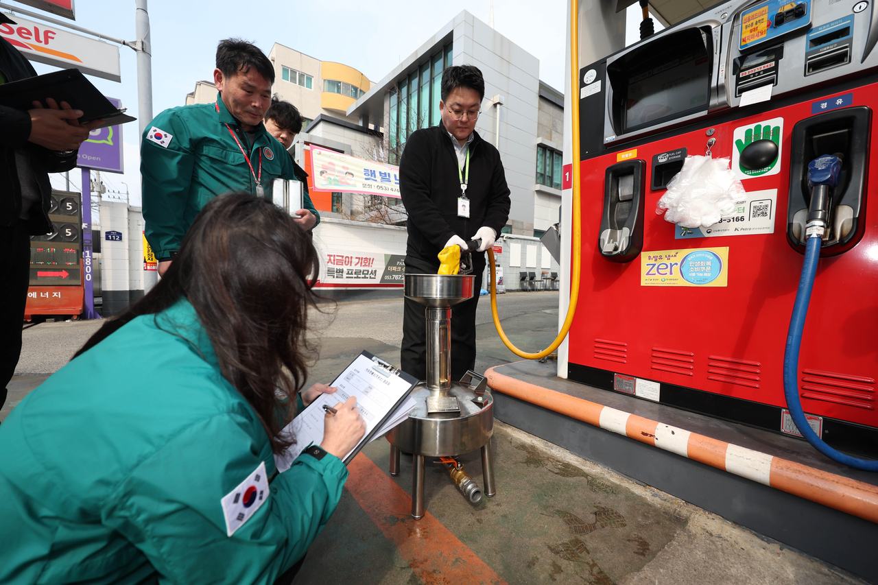 Officials inspect the quality and price of fuel products at a gas station in the southeastern city of Daegu on March 12, 2026. (Yonhap)