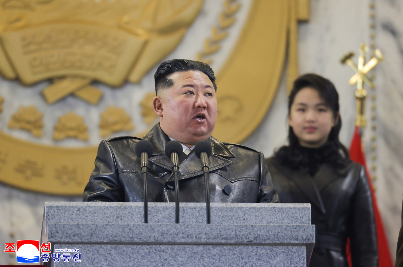 North Korean leader Kim Jong-un speaks during a military parade at Kim Il Sung Square in Pyongyang on Feb. 25, to mark the ninth congress of the ruling Workers' Party, in this photo released by North Korea's official Korean Central News Agency the next day.  (Yonhap)