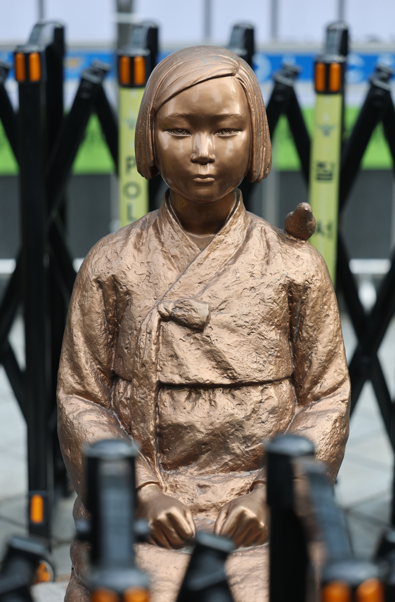 A comfort woman statue sits in front of the former Embassy of Japan in Jongno-gu, Seoul, marking the 10th anniversary of the 2015 South Korea-Japan agreement on the Japanese military “comfort women” issue. (Yonhap)