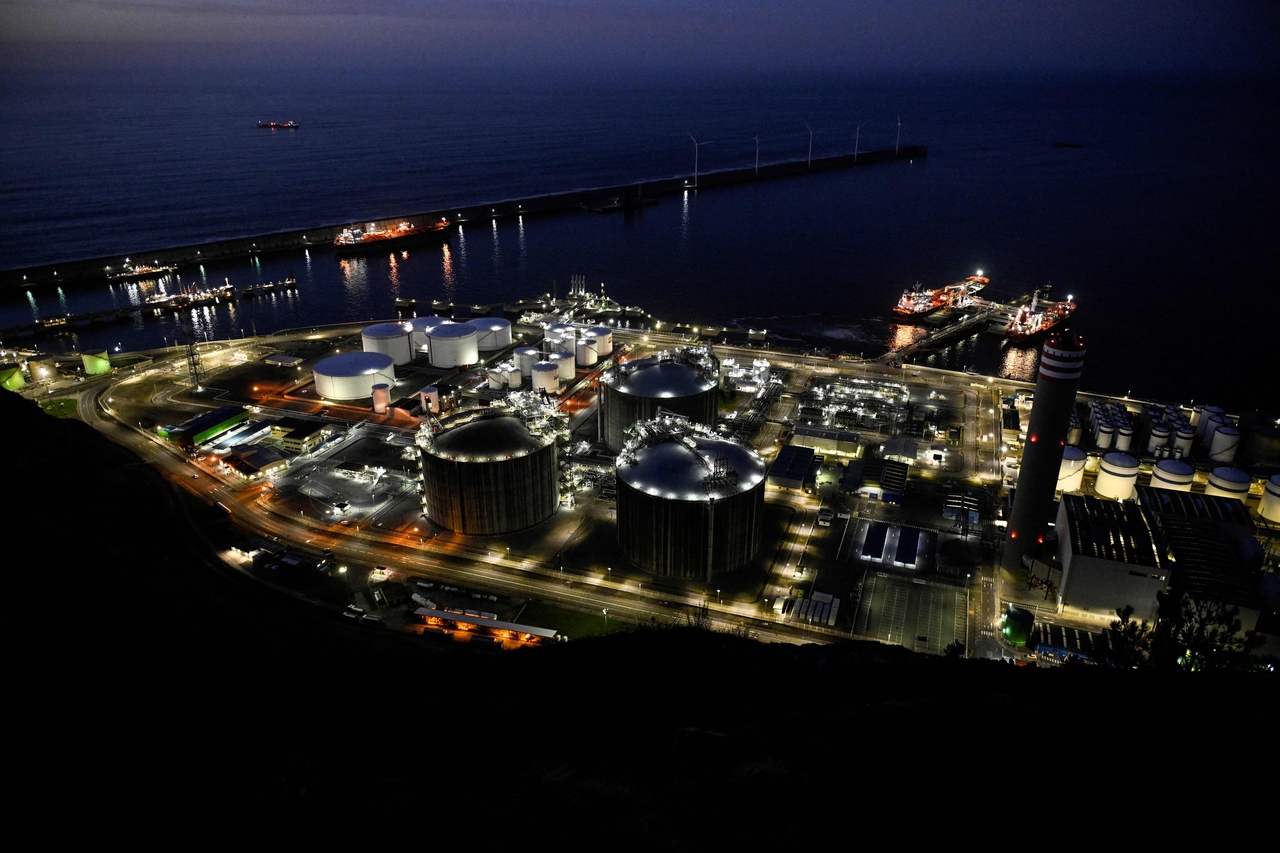 A picture taken at sunset on March 12, 2026 shows a general view of the Bizkaia Bay Gas (BBG) regasification plant in the Spanish Basque city of Zierbena. The US-Israeli war on Iran has expanded across the Gulf and beyond, upending global energy markets and trade, and virtually halting traffic in the Strait of Hormuz, through which a fifth of the world's crude oil travels. (AFP)