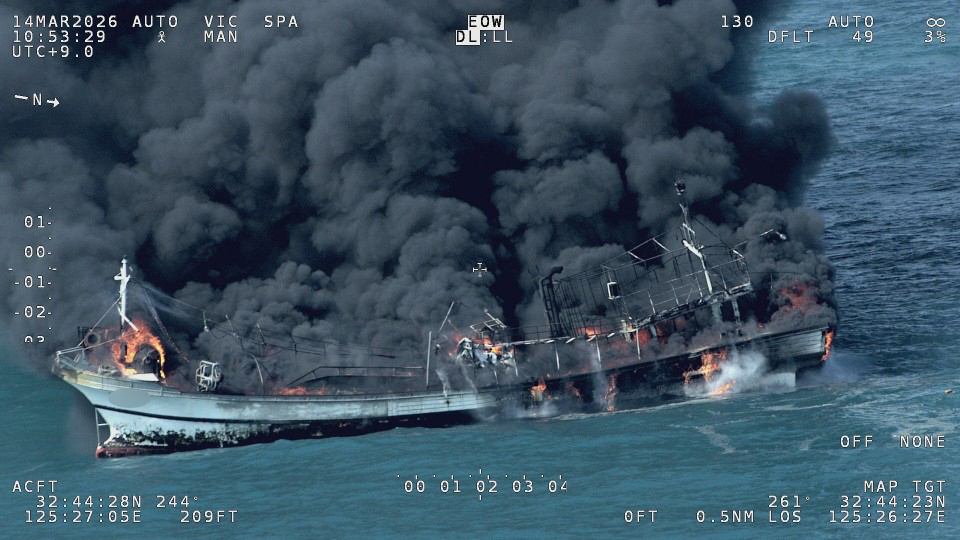 This image provided by the Coast Guard shows a fishing vessel on fire with columns of black smoke billowing from the ship off the southern island of Jeju on Saturday. (Yonhap)