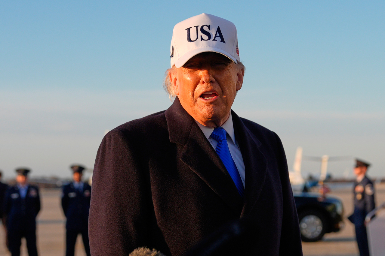 President Donald Trump speaks to reporters before he boards Air Force One, Friday, at Joint Base Andrews, Md., for a trip to Florida. (AP-Yohap)