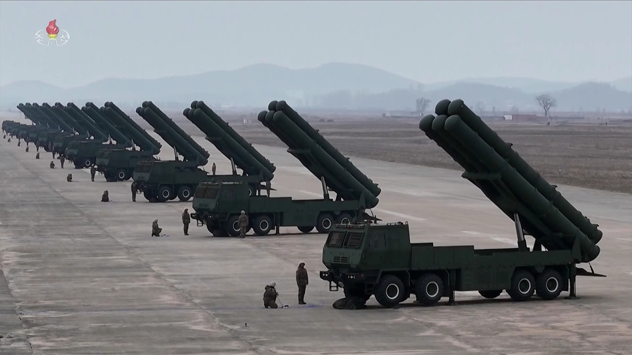 North Korea's leader Kim Jong-un attends a firepower strike drill inloving 600-millimeter ultra-precision multiple eroket lauchers on Saturday. (Yonhap)