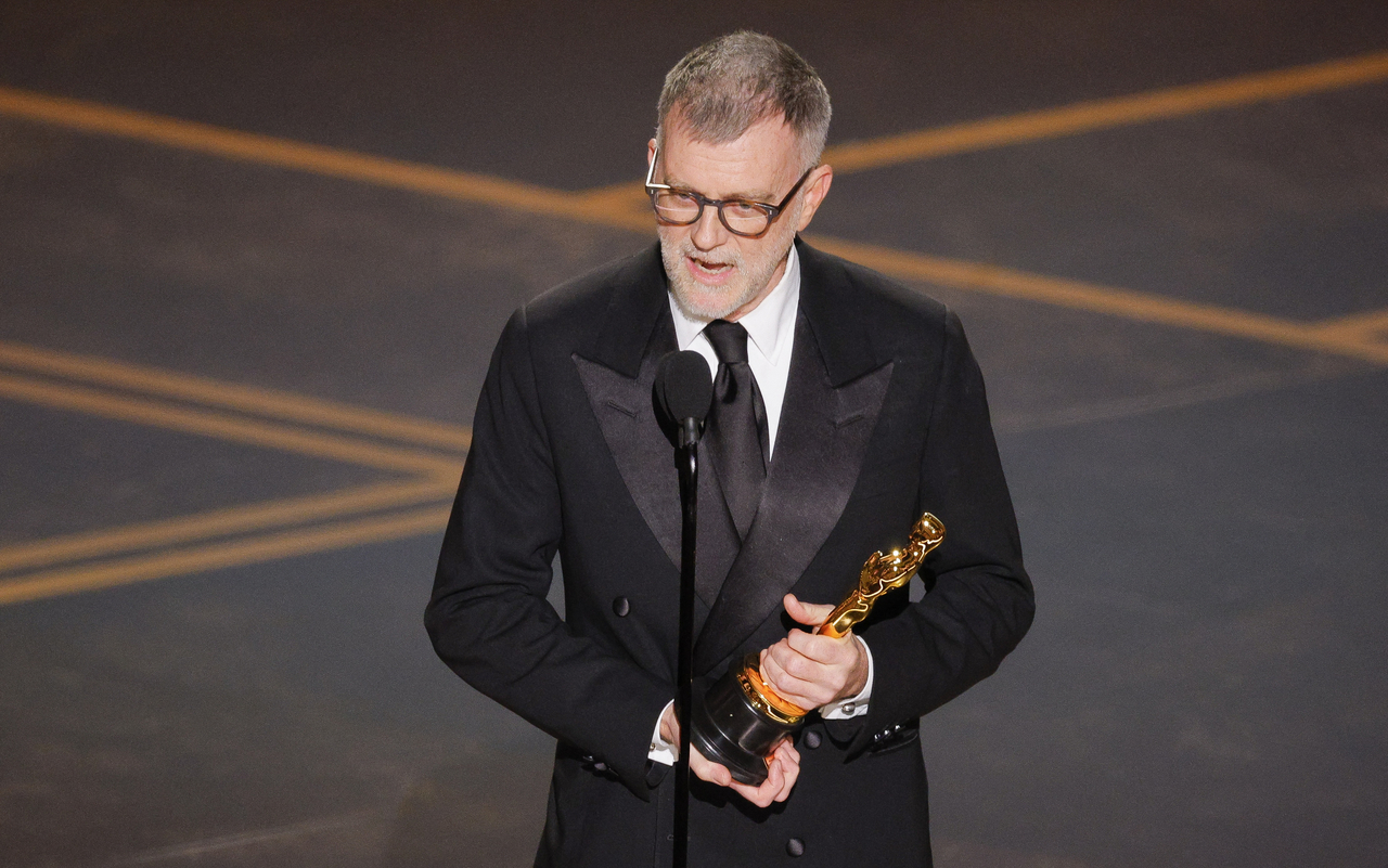 Paul Thomas Anderson wins the Oscar for Best Adapted Screenplay for "One Battle after Another" during the Oscars show at the 98th Academy Awards in Hollywood, Los Angeles, Sunday. (Reuters-Yonhap)