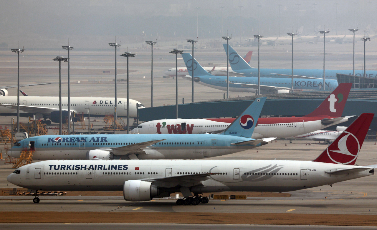Airplanes are seen at the Incheon International Airport on Monday. (Yonhap)