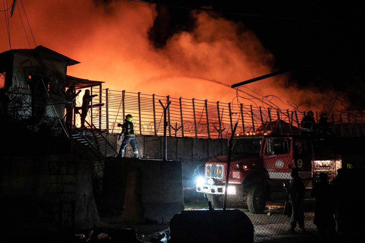 Firefighters work to extinguish a fire at the Secondary Rehabilitation Services Centre in Kabul, Afghanistan, Monday. (AFP-Yonhap)