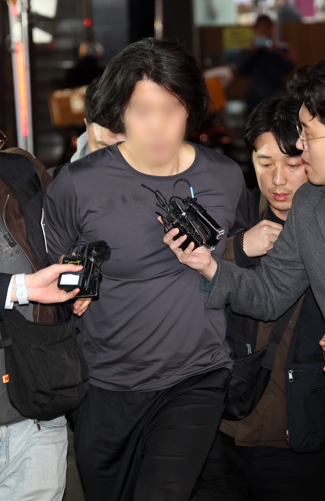 The former pilot accused of murdering his colleague is being taken to the Busanjin Police Station in Busan on Tuesday. (Newsis)