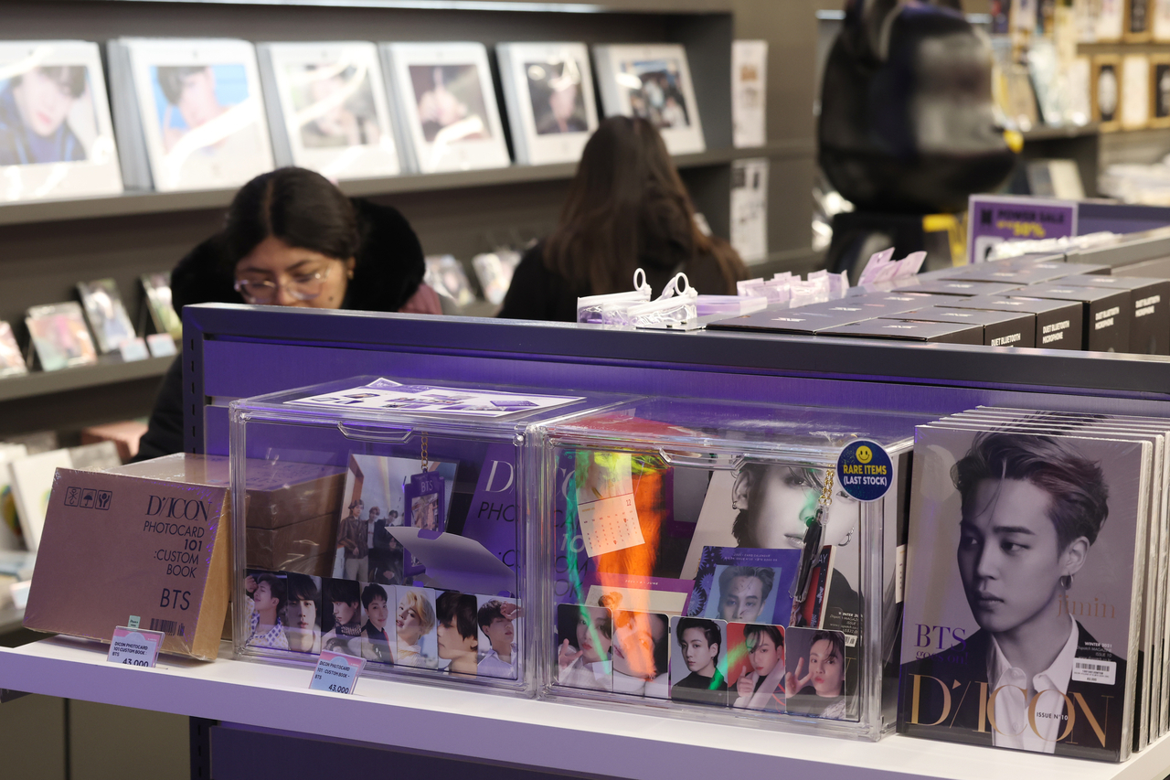 K-pop fans browse BTS merchandise at a shop in Myeong-dong, Seoul, on Sunday, six days before the BTS comeback concert in Gwanghwamun Square. (Yonhap)