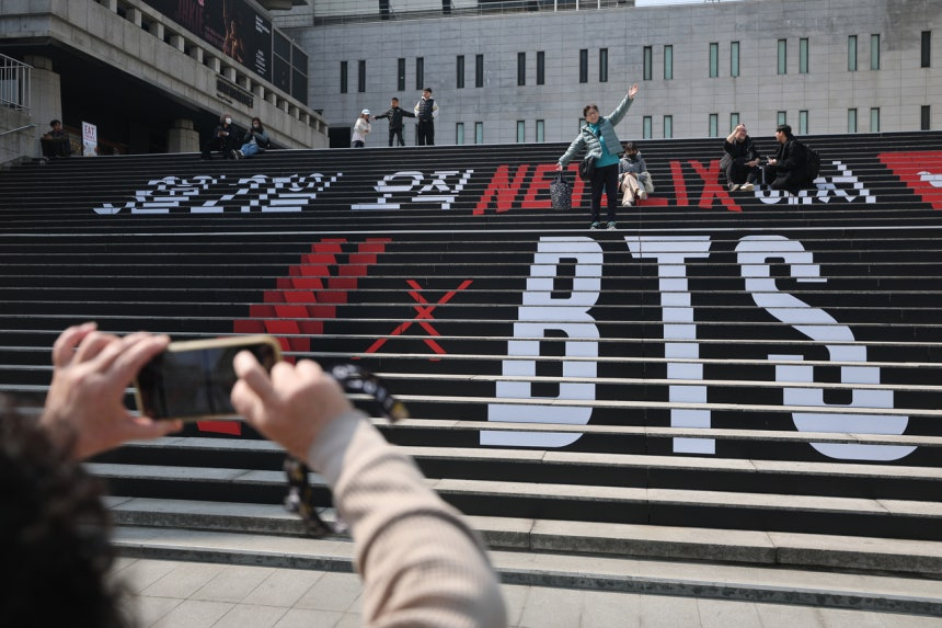 Promotional messages for BTS’s comeback concert are displayed on the steps of the Sejong Center for the Performing Arts in Seoul on Tuesday. ()