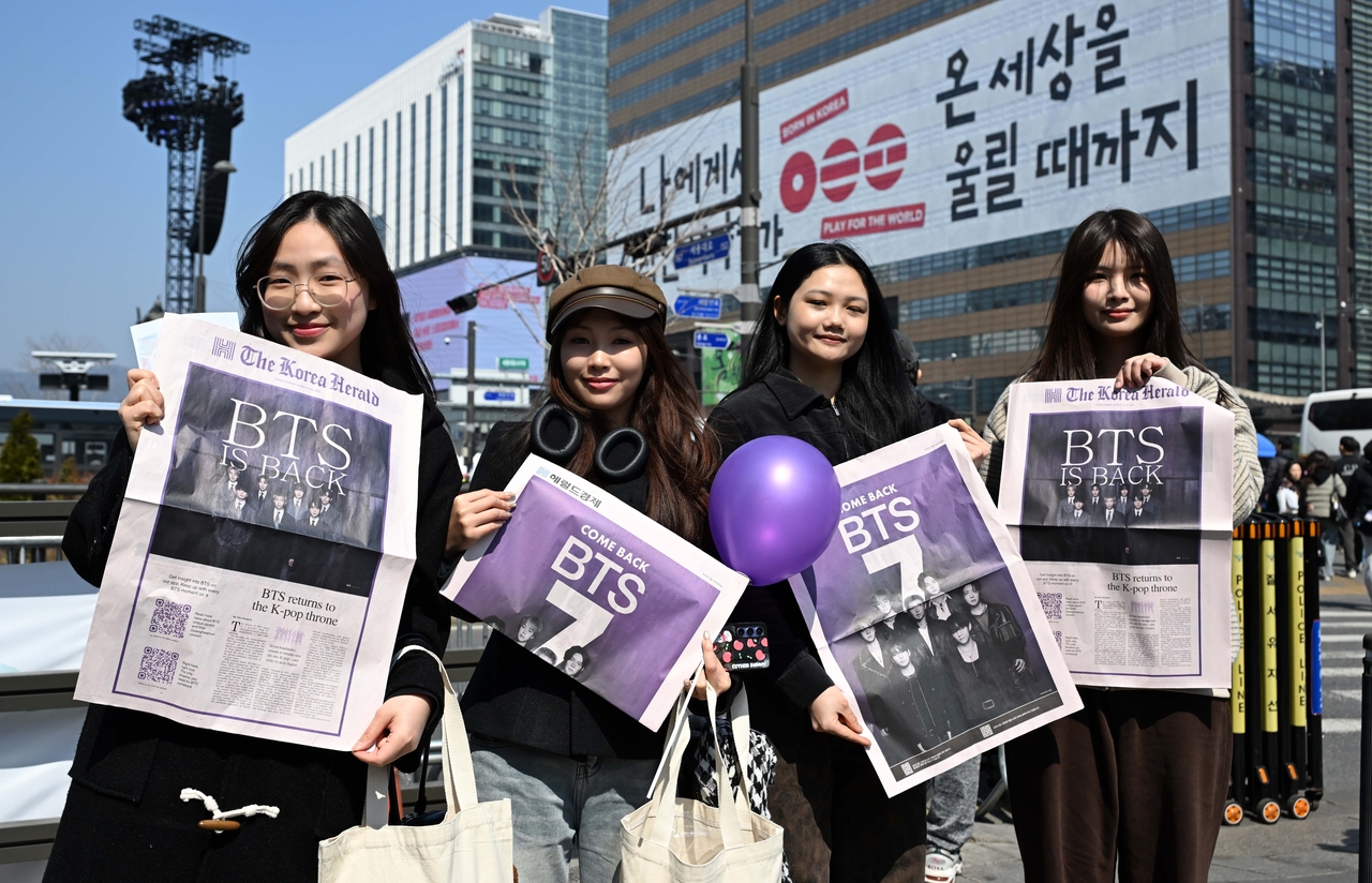 BTS fans with The Korea Herald's BTS special edition.
