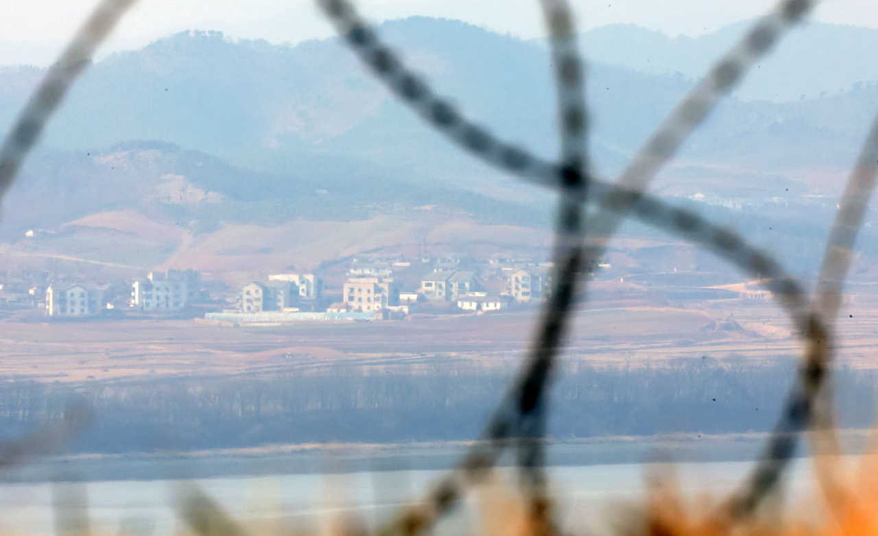 A village in Kaepung County, North Hwanghae Province, North Korea, is seen from the Odusan Unification Observatory in Paju, Gyeonggi Province, on March 15, 2026. (Newsis)