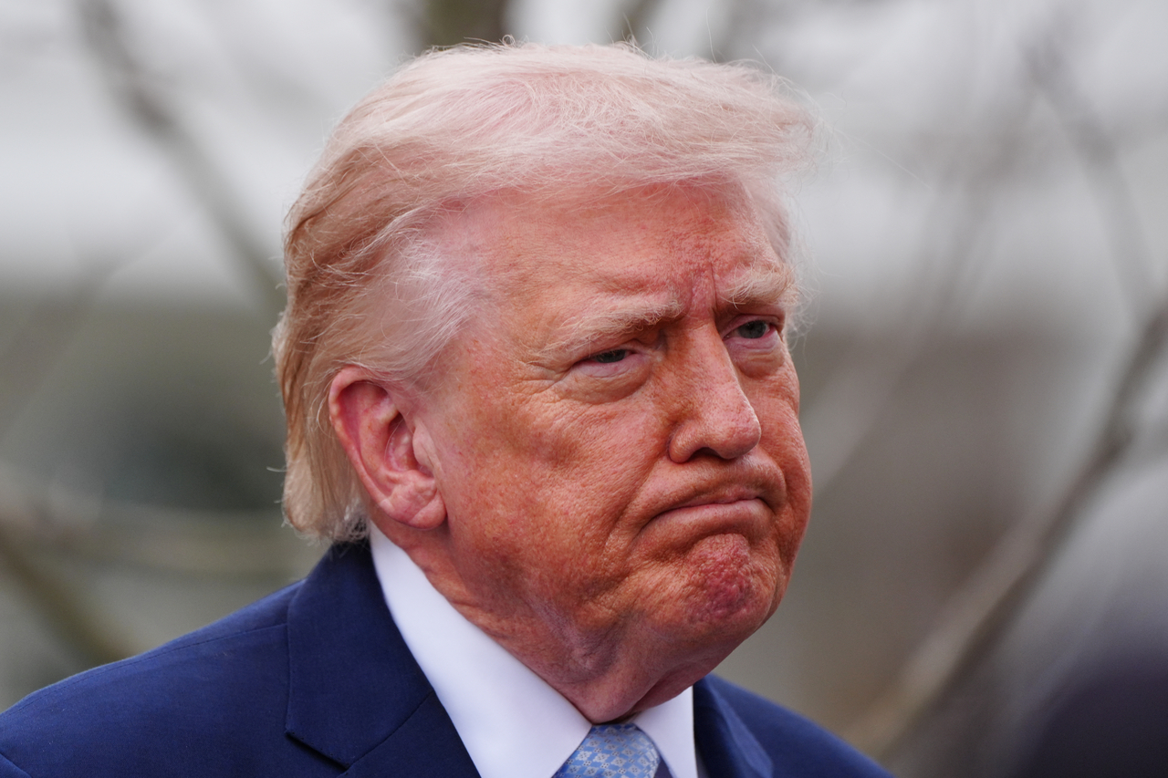President Donald Trump speaks with reporters before departing on Marine One from the South Lawn of the White House, Friday, in Washington. (AP-Yonhap)