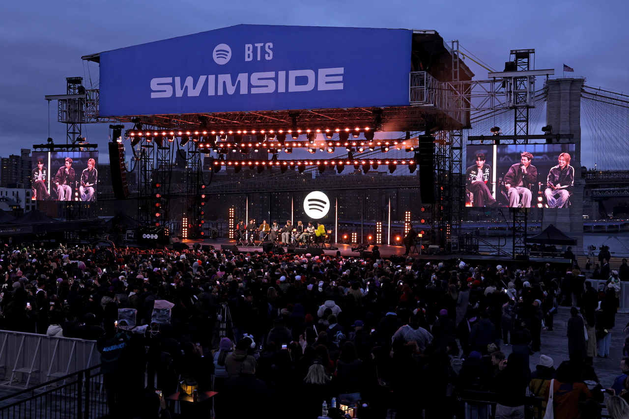 BTS and Suki Waterhouse speak onstage during 