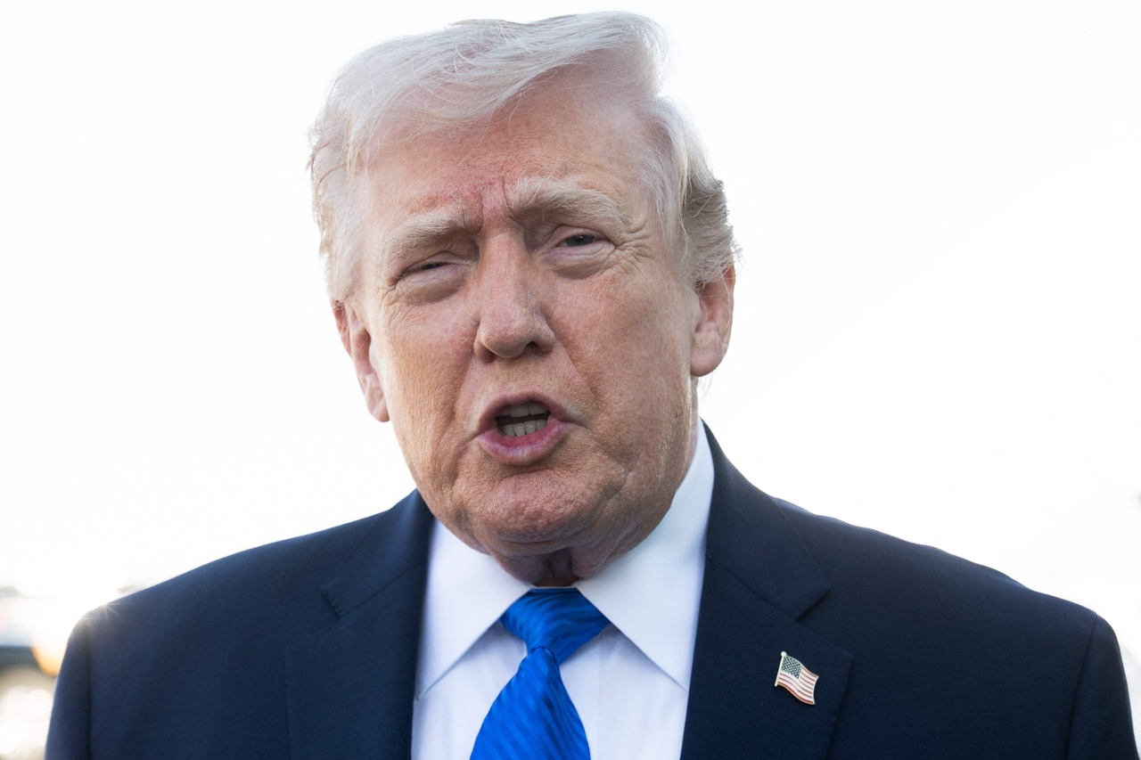 US President Donald Trump speaks to reporters before boarding Air Force One at Palm Beach International Airport in West Palm Beach, Florida, on Monday. (AFP-Yonhap)
