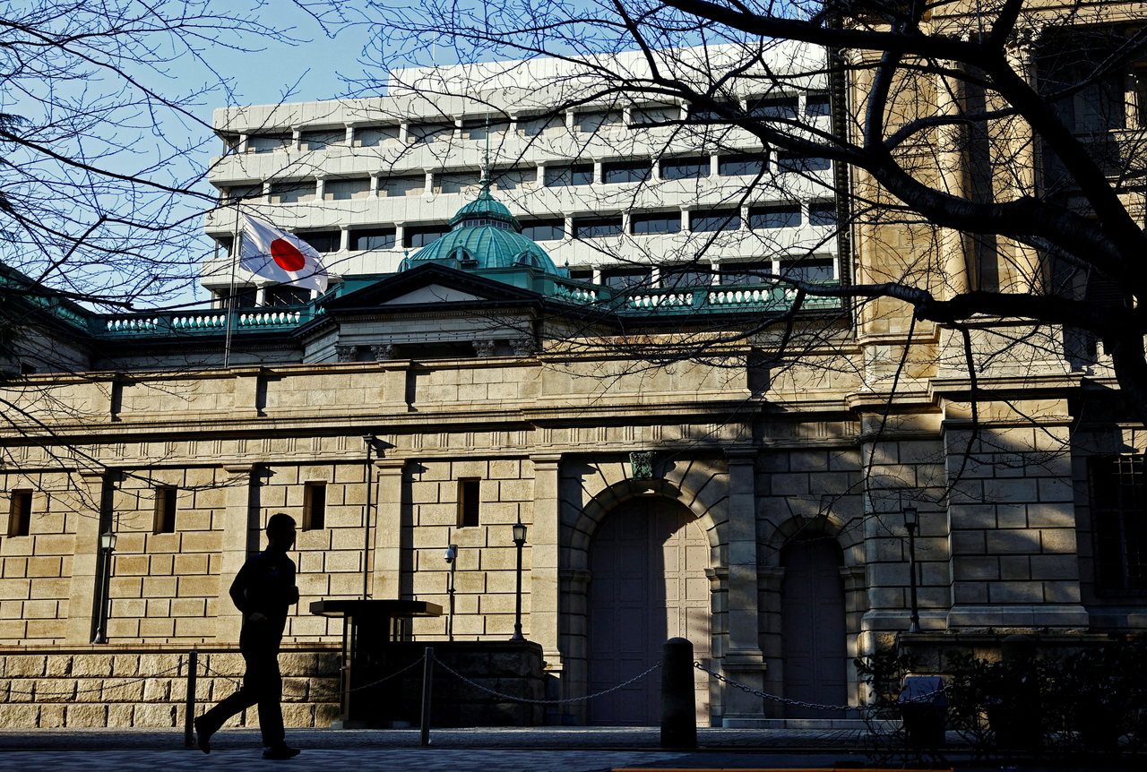 A passerby walks past in front of the Bank of Japan headquarters in Tokyo on Jan. 23, 2025.  Reuters-Yonhap