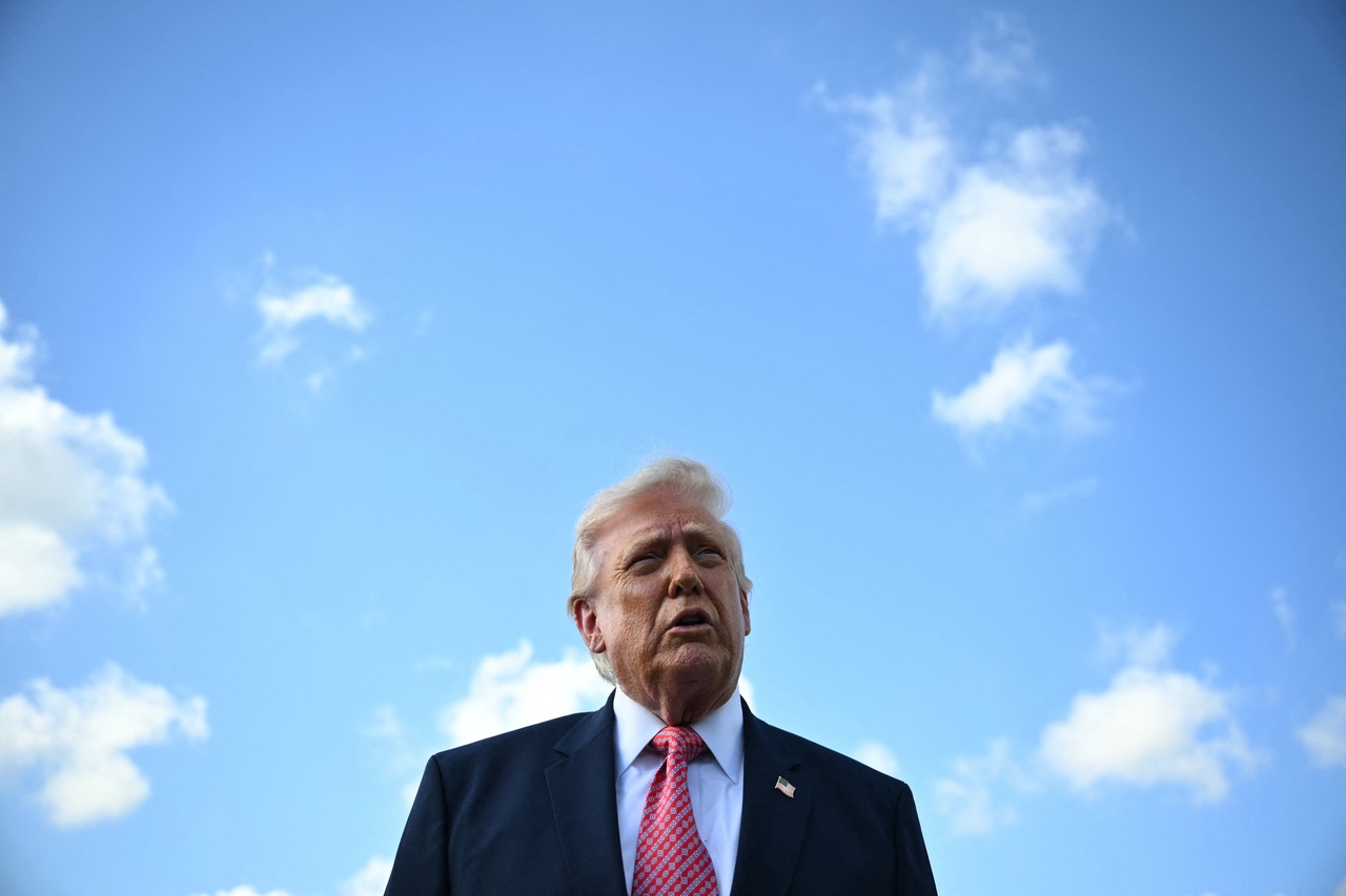 US President Donald Trump speaks to the press upon arrival at Miami International Airport in Miami, Florida, Friday. (AFP-Yonhap)