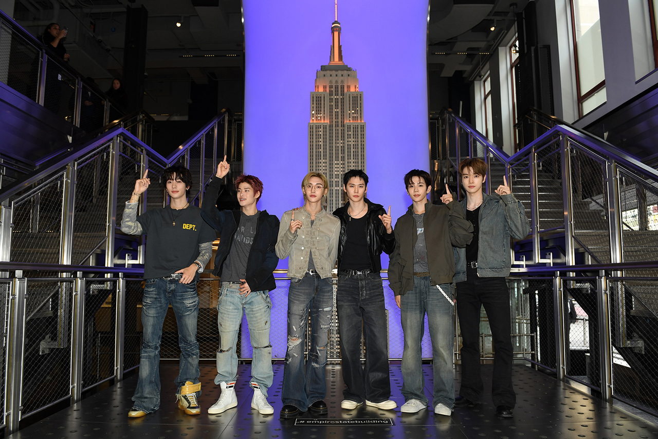 Riize attends a lighting ceremony at the Empire State Building in New York on Oct. 29, illuminating the landmark in the group’s signature orange ahead of a show on its first world tour, “Riizing Loud.” (SM Entertainment)