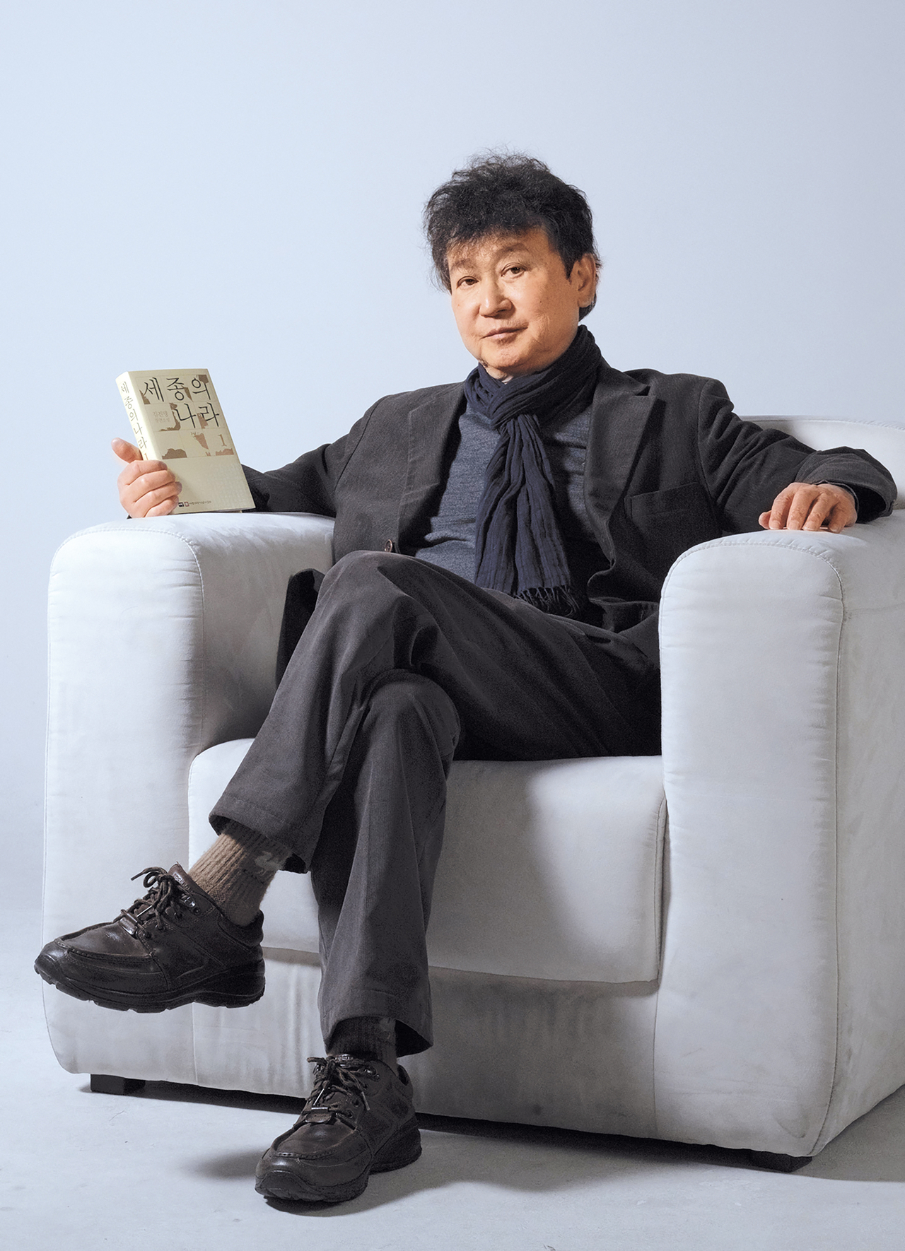 Kim Jin-myung poses for photos during an interview with The Korea Herald on Monday. (Lee Sang-sub/The Korea Herald)