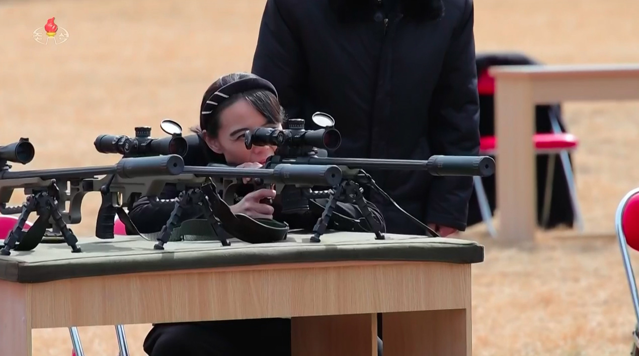 A screen capture of Korean Central Television shows Kim Yo-jong firing an assault rifle, Friday. (Newsis)