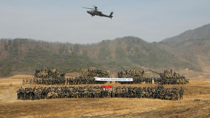 Korean and US troops pose after completing a combined arms live-fire exercise at Rodriguez Live Fire Complex in Pocheon, Gyeonggi Province, March 24. (Courtesy of US Army)