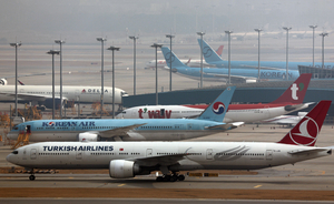 As oil shock hits skies, travelers face more fees, fewer flights