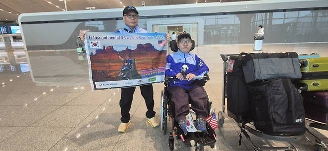 Bae Jong-hoon (left) and his son, Bae Jae-guk, pose for a photo at Incheon International Airport. (Courtesy of the Bae family)