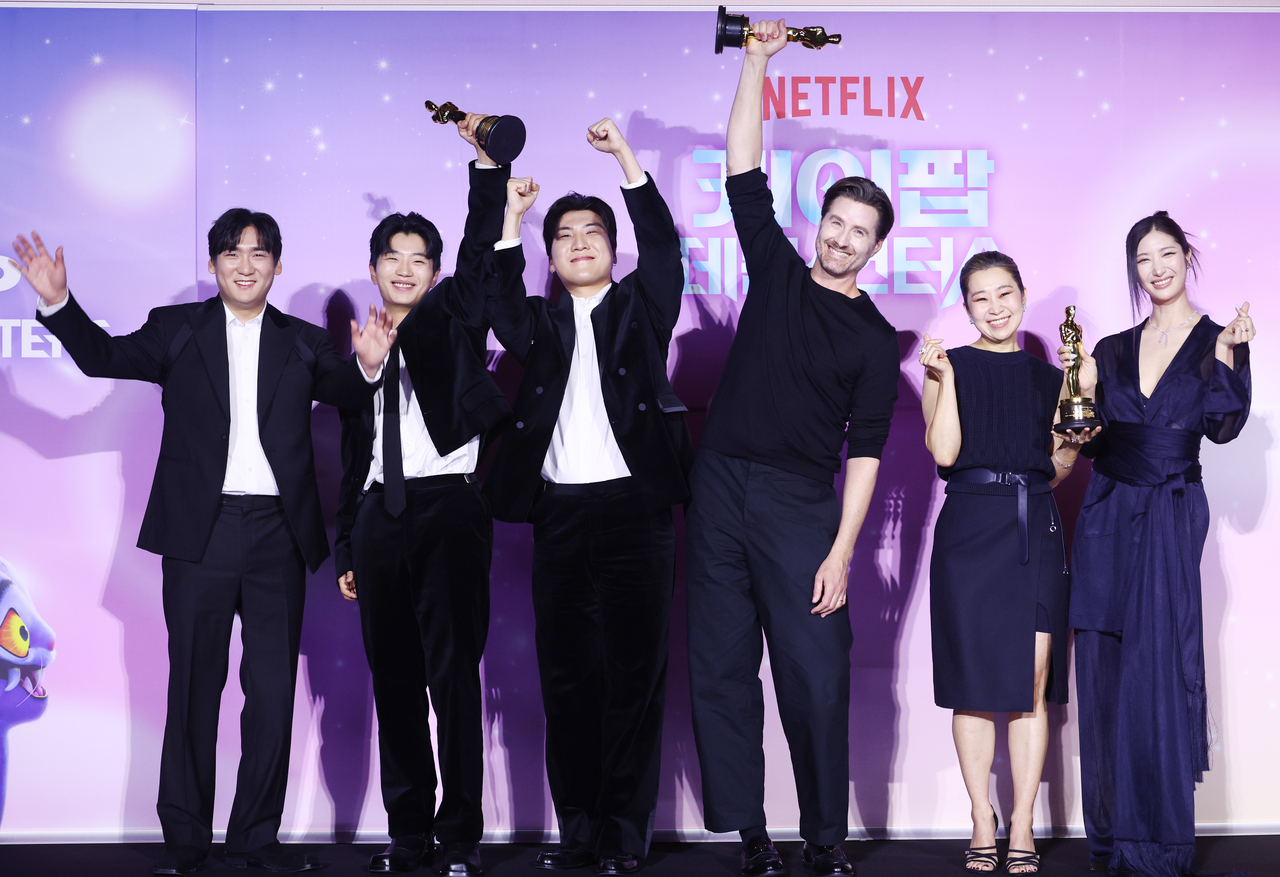From left: Producers Nam Hee-dong, Lee Yu-han and Kwak Joong-kyu, director Chris Appelhans, director Maggie Kang and singer-songwriter Ejae pose at a press conference for Netflix's "KPop Demon Hunters" at CGV Yongsan in Seoul on Wednesday. (Yonhap)