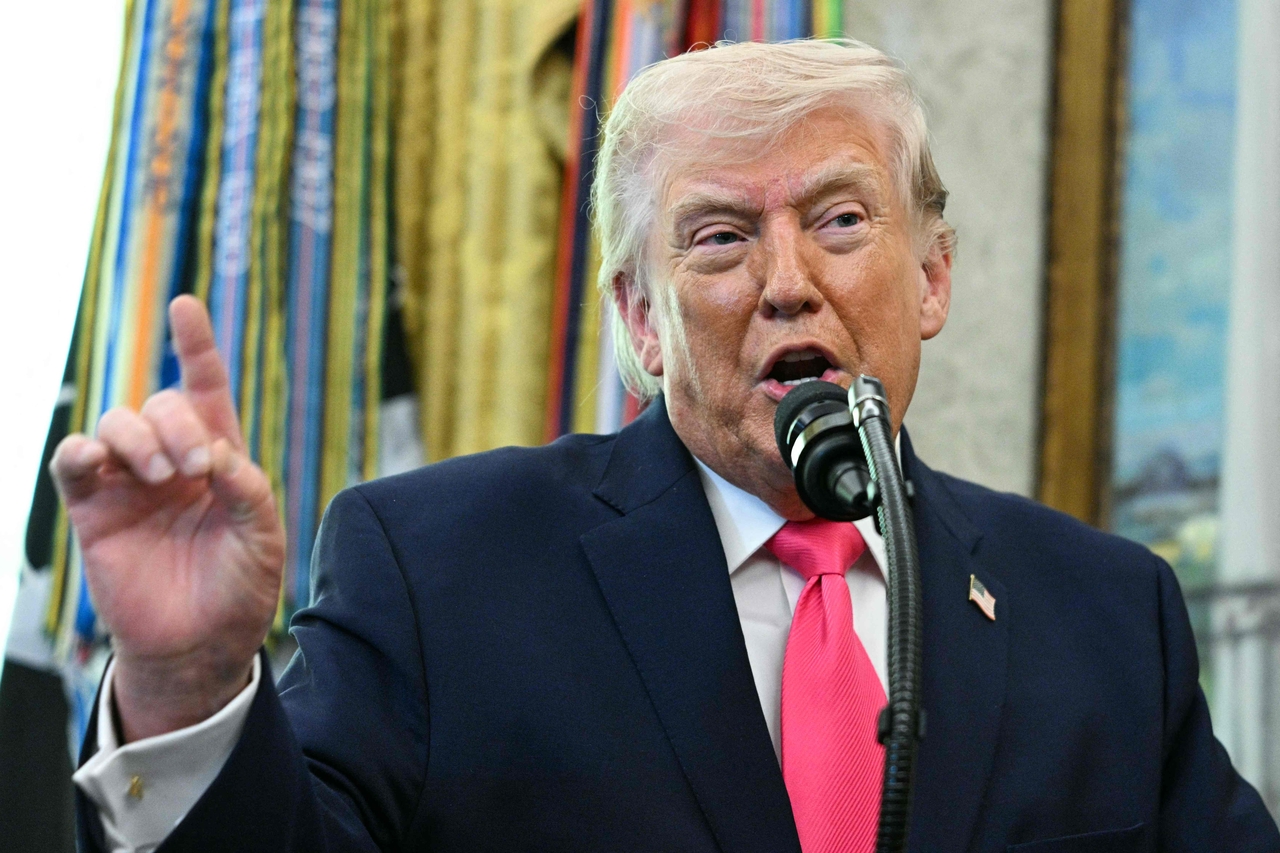 This photo, released by AFP, shows US President Donald Trump speaking during a swearing-in ceremony for new Homeland Security Secretary Markwayne Mullin in the Oval Office of the White House in Washington on March 24, 2026. (Yonhap)