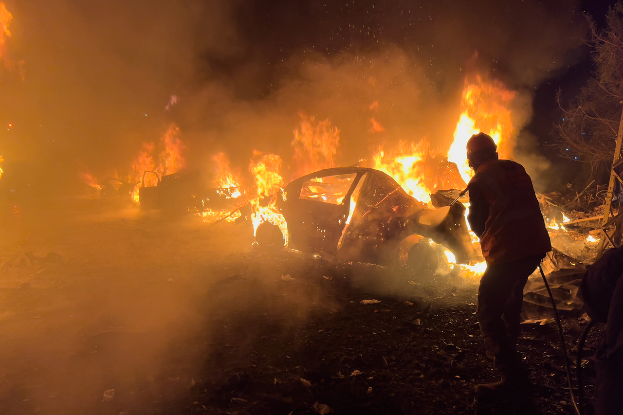 A firefighter extinguishes a car at the site of Israeli airstrikes in Beirut, Wednesday. (AP-Yonhap)