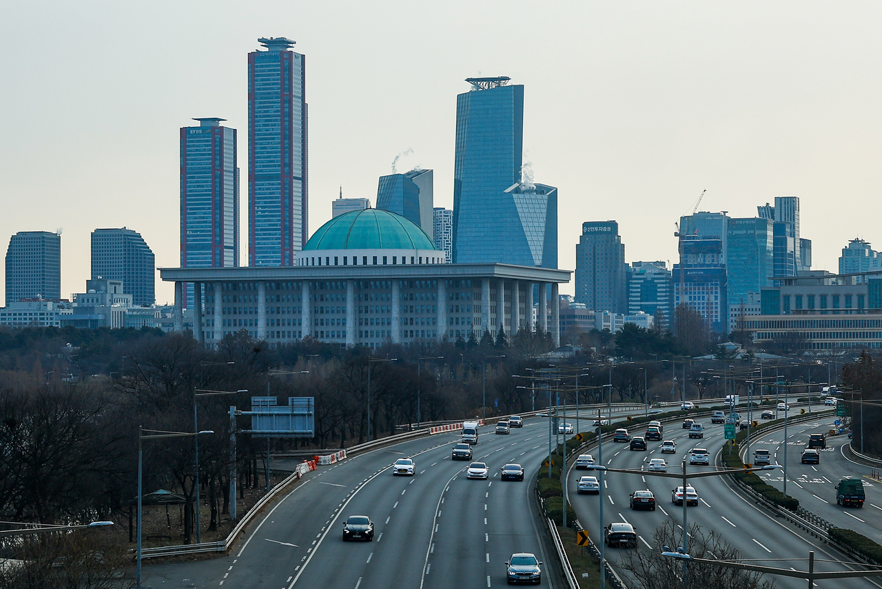 The National Assembly  is seen against the backdrop of buildings in Yeouido, Seoul. (GettyImages)
