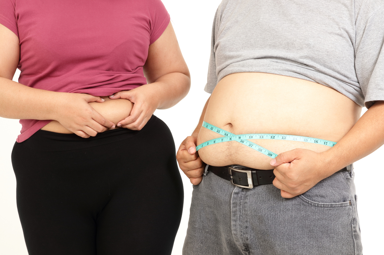 A stock photo of an overweight man and woman. (123rf)