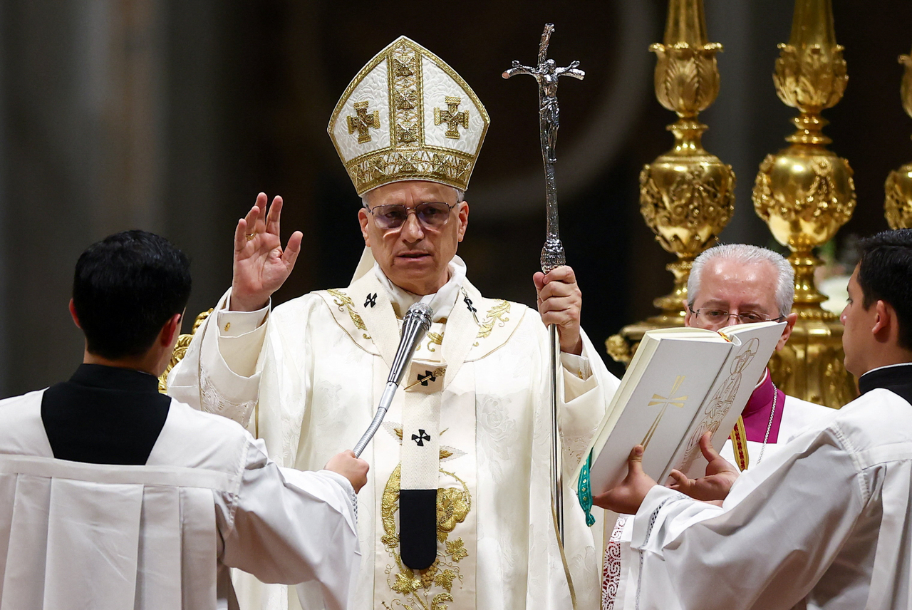 Pope Leo XIV blesses faithful during the Easter Vigil in Saint Peter's Basilica at the Vatican, Saturday.   Reuters-Yonhap