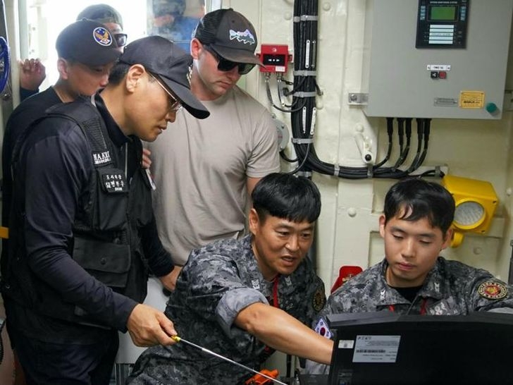 Personnel from the Ministry of National Defense, US Forces Korea and the US Defense POW/MIA Accounting Agency analyze data during an underwater search for US war dead from the 1950-53 Korean War in September 2023. (Defense Ministry)