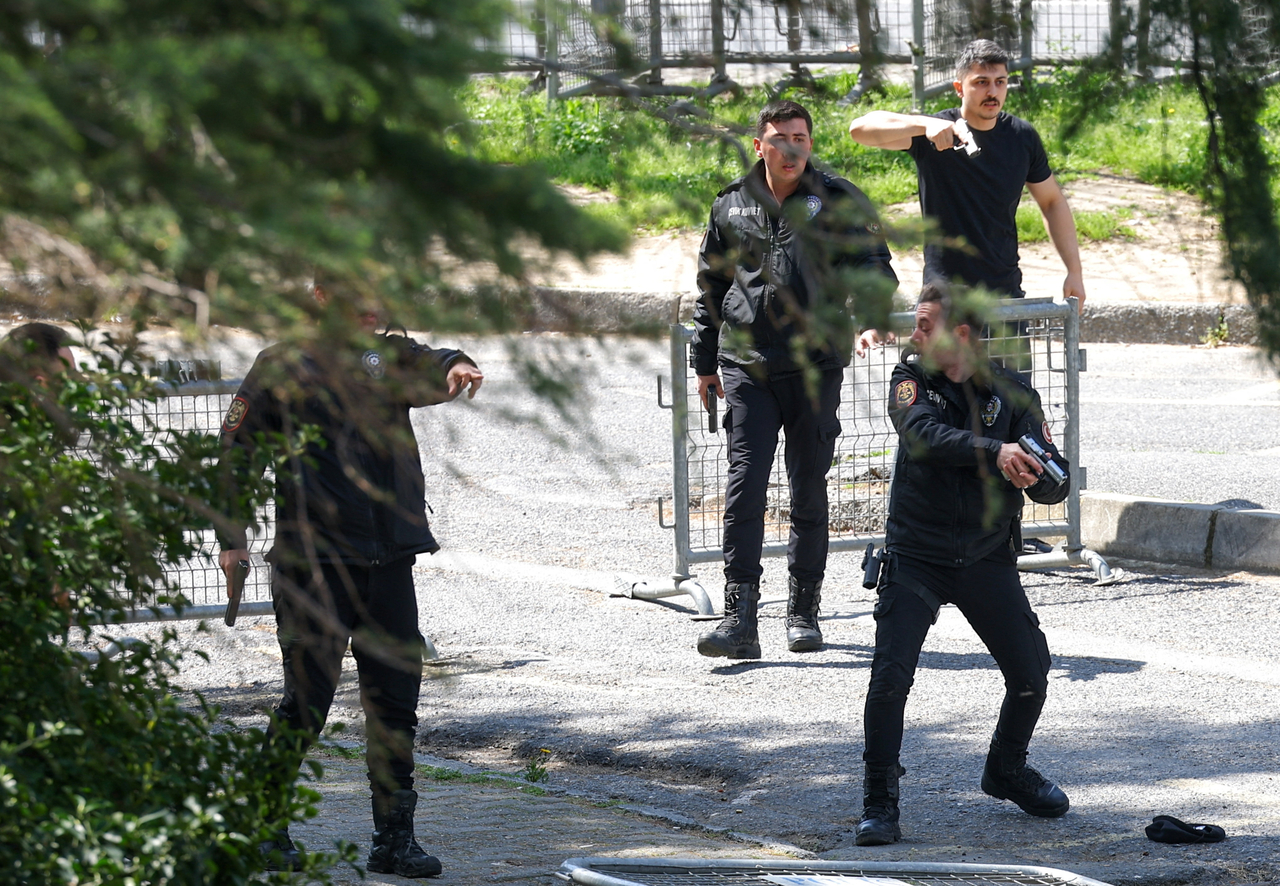 Police in action at the scene, after gunfire was heard near the building housing the Israeli consulate, according to a witness, in Istanbul, Turkey, on Tuesday. (Reuters)