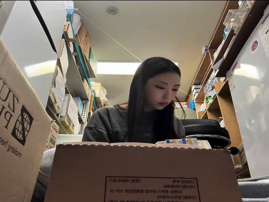 Kim Hee-soo sorts and organizes essential medical supplies sent from Korea. (Kim Hee-soo)