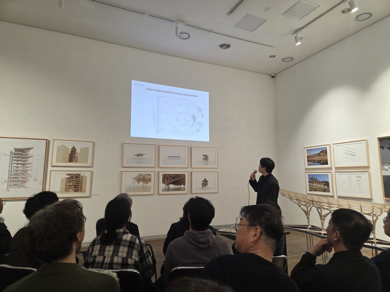 Professor Kim Jae-kyung speaks at the exhibition marking the publication “Timbercraft: Lost Tectonics from East Asia" at Topohaus in Seoul on April 4. (Park Yuna/The Korea Herald)
