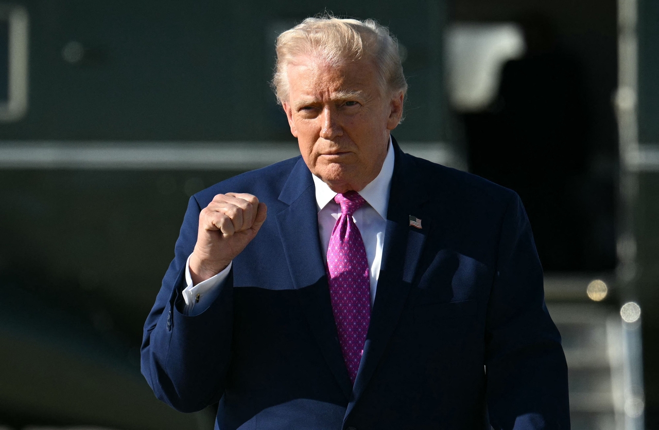US President Donald Trump gestures after stepping off Marine One at Joint Base Andrews, Maryland, Friday. (AFP via Yonhap)