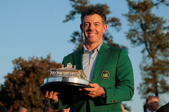 Rory McIlroy celebrates with his green jacket and the trophy after winning the Masters, in Augusta, Georgia, Sunday.    (Reuters-Yonhap)