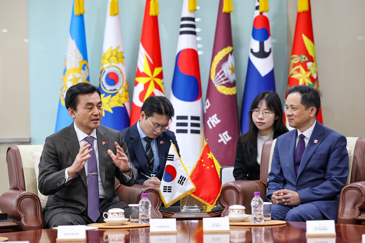 This photo, provided by the defense ministry, shows Defense Minister Ahn Gyu-back (L) and Chinese Ambassador to South Korea Dai Bing (R) holding talks in Seoul on April 15, 2026. (Yonhap)