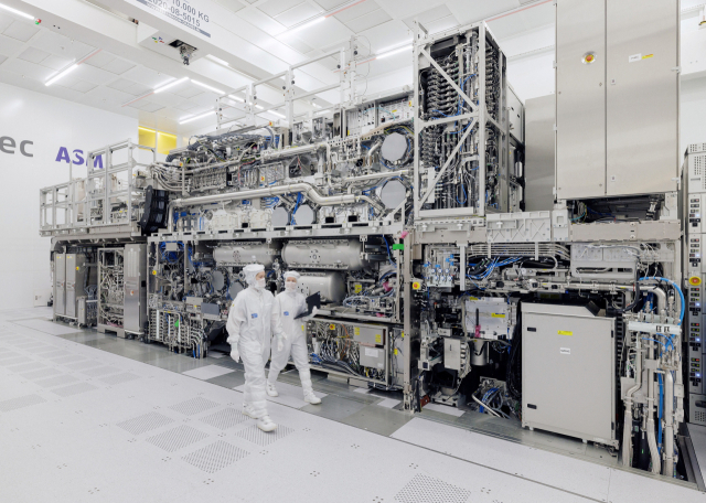 Engineers at ASML inspect a high-NA EUV lithography system. (ASML)