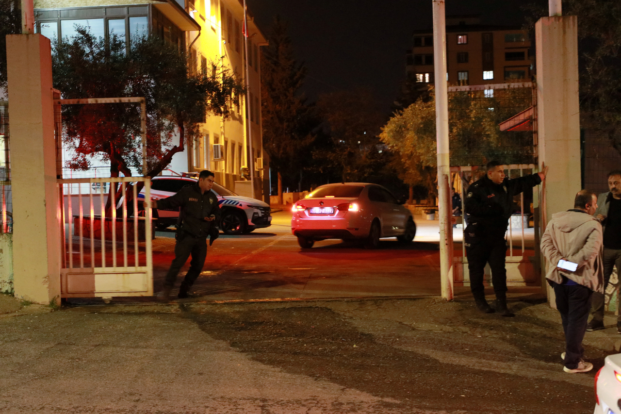 Police officers guard the main entrance of a school where a shooting took place early in the day, in the Turkey's southeastern province of Kahramanmaras, Turkey, Wednesday. (Reuters-Yonhap)