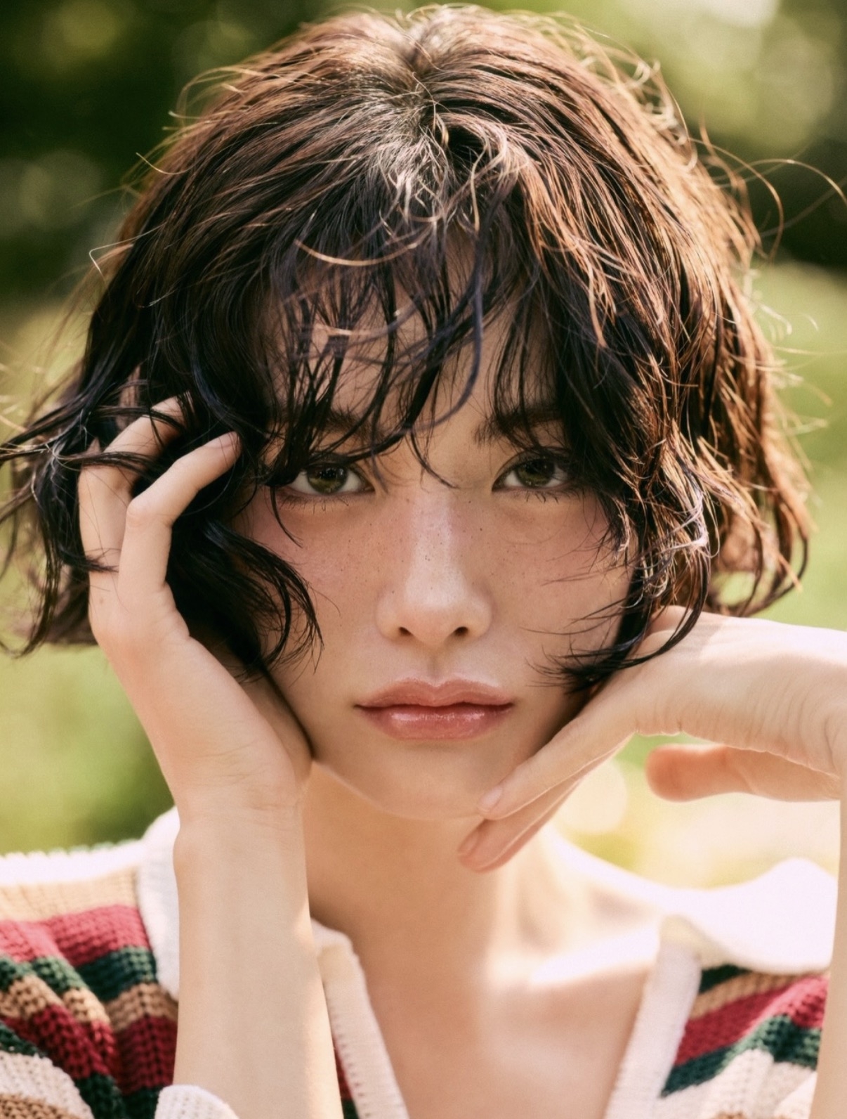 Nana's softly textured bob with tousled waves and wispy bangs creates a relaxed, undone look that emphasizes natural movement and lightness. (Knock Comma)Screenshot