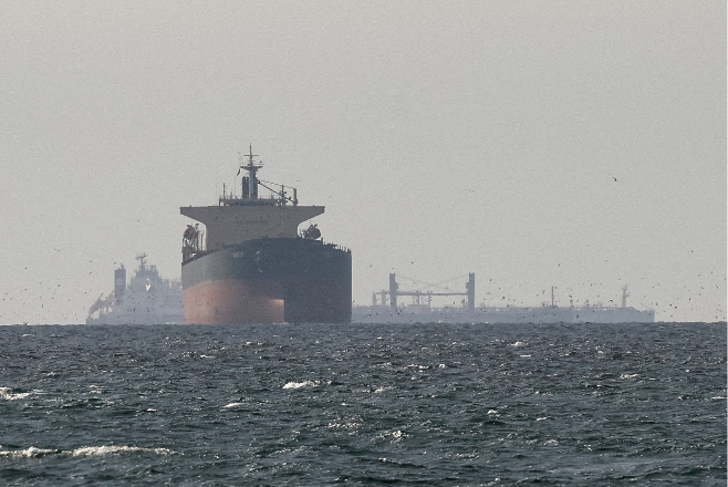 Cargo ships are seen in the Persian Gulf from northern Ras al-Khaimah, United Arab Emirates, on March 11. (Reuters-Yonhap)