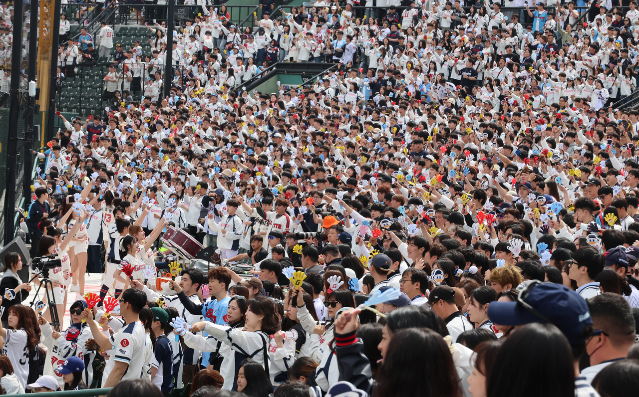 A sellout crowd cheers during a baseball game between the SSG Landers and the Lotte Giants at Sajik Baseball Stadium in Busan on April 5.   Yonhap