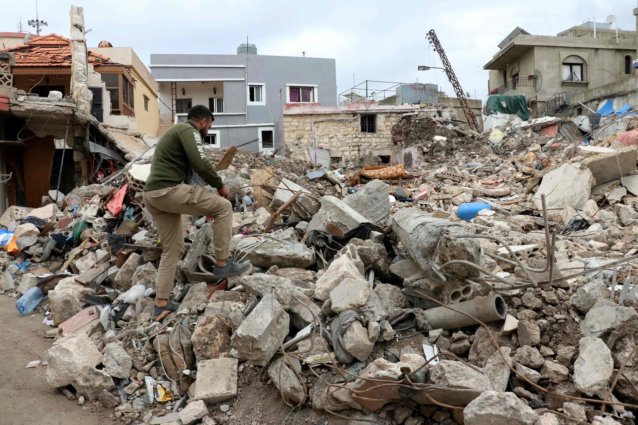 A man searches in the rubble of his destroyed house in Srifa, Lebanon, Sunday. (AFP-Yonhap)