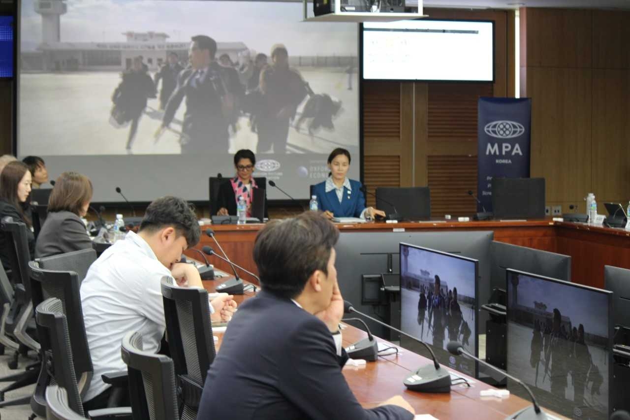 Urmila Venugopalan (rear, left), president and managing director of the Motion Picture Association's Asia-Pacific region, and Rep. Lim O-kyeong of the Democratic Party of Korea attend the seminar unveiling MPA Korea's Economic Contribution Report on Korea's audiovisual industry at the National Assembly in Seoul on Tuesday. (Elixir Communications)
